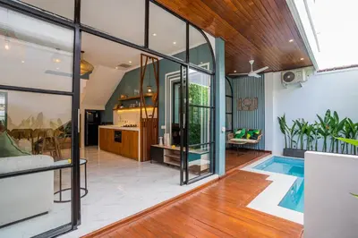 a living room with a swimming pool in a house at NEW! Villa Sony 1 - 3BR Villa next to Legian Beach in Seminyak