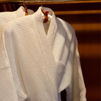 two white shirts are hanging on a rack at Salt Hideaway - 2 BR apartment, central Seminyak in Seminyak