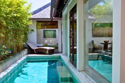 a swimming pool in the backyard of a house at Liam 1 BR Bamboo Private Pool Villa JU63 in Seminyak