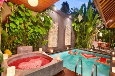 a hot tub in the middle of a garden at Sadawira 1 BR Private Pool Villa & Bathtub ZN168 in Legian