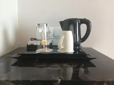 a black and white blender sitting on top of a counter at Sovereign Bali Hotel in Kuta