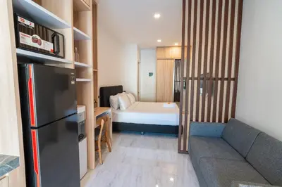 a small room with a bed and a couch at Alyxia 1 Bedroom Apartment in Central Seminyak in Seminyak