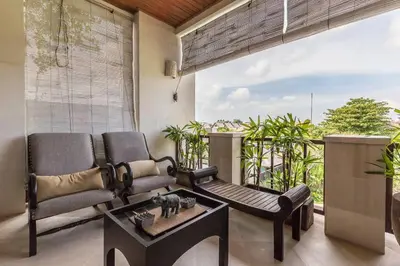 a living room with two chairs and a table at Quiet Central Seminyak 2bd 2 bath and walk to eat st in Seminyak