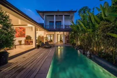 a swimming pool in the backyard of a house at Villa Catalina Seminyak in Seminyak