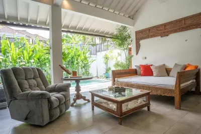 a living room with a couch and a coffee table at Villa Catalina Seminyak in Seminyak