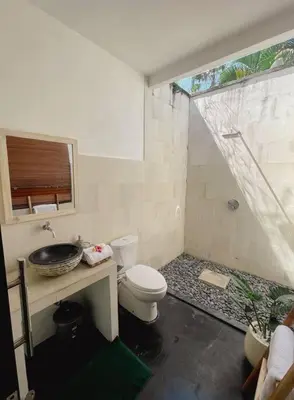 a bathroom with a toilet and a sink at Nawa Villa private pool 3bedrooms in Seminyak