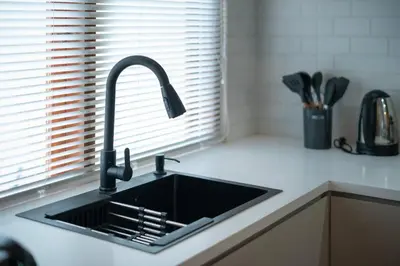 a black sink in a kitchen with a window at Villa Uma Sari c9 in Seminyak
