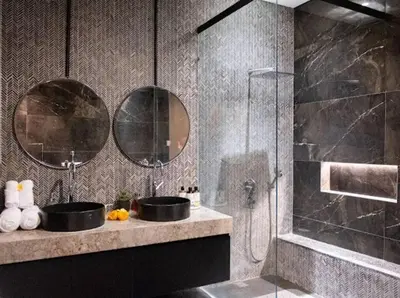 a bathroom with a sink and a shower with two mirrors at Modern Palace in Seminyak - Qmoya Villa in Seminyak