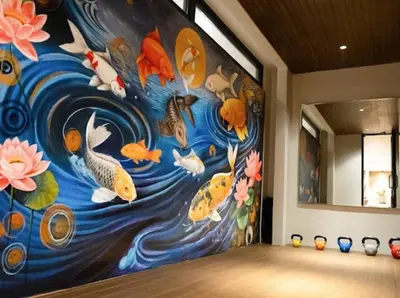 a room with a painting of fish on the wall at Modern Palace in Seminyak - Qmoya Villa in Seminyak