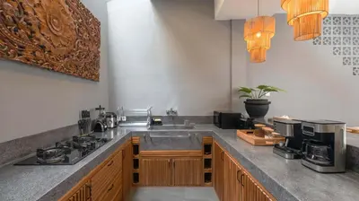 a kitchen with a sink and a counter top at Villa Alami by Villa Finder in Seminyak