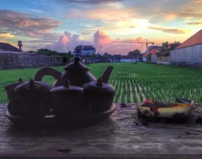 a painting of a group of tea pots in a field at Villa Chandra in Seminyak