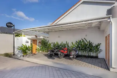 a group of motorcycles parked outside of a building at Cove Lotus Lofts Seminyak in Seminyak