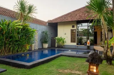 a swimming pool in the backyard of a house at VIlla Dafne in Seminyak