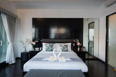a bedroom with a large bed with a swan on it at 7to8BR 40 off special Brilliant Location in Seminyak