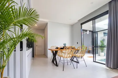 a dining room with a table and chairs at Letto 2 - Amazing 2BR Villa in Canggu with Private Pool in Canggu