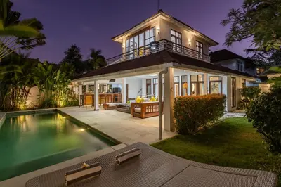 a house with a swimming pool in front of a house at 3 BR Villa in d' centre Seminyak in Seminyak