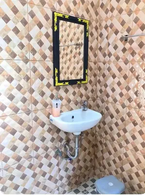 a bathroom with a sink and a mirror at Taman Giri House 3 Bedrooms Nusa Dua in Nusa Dua