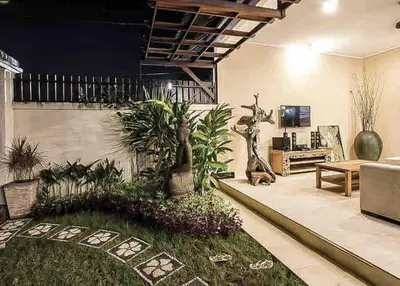 a living room with a couch and some plants at Seminyak Beach Villa Ashira SUPERB Location in Seminyak