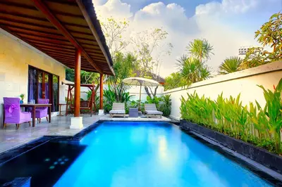 a swimming pool in the backyard of a house at Lavender Private Villa Kuta Bali in Kuta