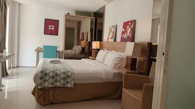 a bedroom with a large bed in a room at 2 BR Bougenville Villa in Nusa Dua