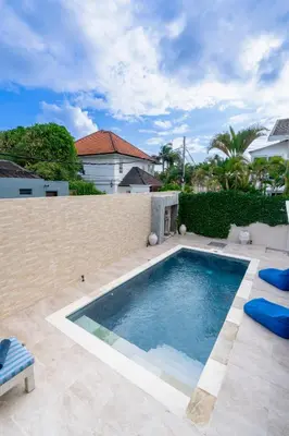 a swimming pool in the backyard of a house at Villa Bella Vista by Pertama Management in Seminyak