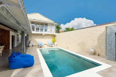 a swimming pool in the backyard of a house at Villa Bella Vista by Pertama Management in Seminyak