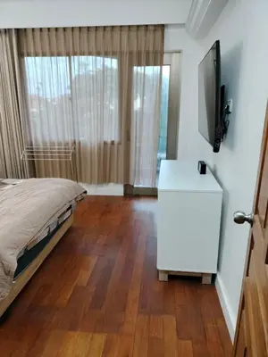 a bedroom with a bed and a television on a dresser at Jayakarta Bali Apartment 6417 in Seminyak