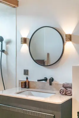 a bathroom with a sink and a mirror at Villa Moana - Incredible 2BR Villa Next To The Beach in Canggu in Canggu