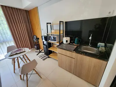 a kitchen with a sink and a counter top at de' Asasta Apartment Benoa E216 in Nusa Dua