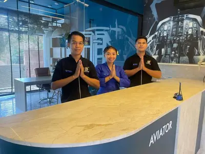 a group of men standing in front of a table at Aviator Bali in Canggu