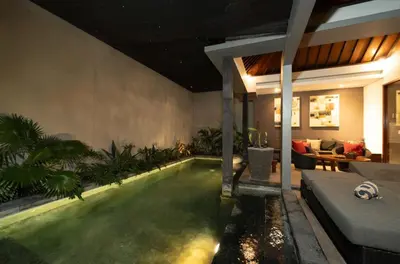a swimming pool in a house with a living room at The Black Pearl - The Best 1br Villa In Seminyak in Seminyak