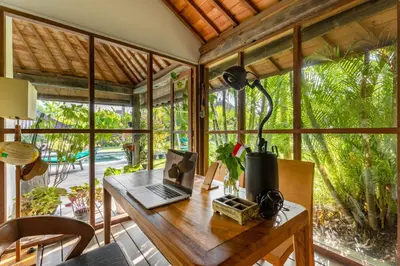 an office with a desk with a laptop on it at Villa Tago - 5 BR Villa in Umalas in Kerobokan