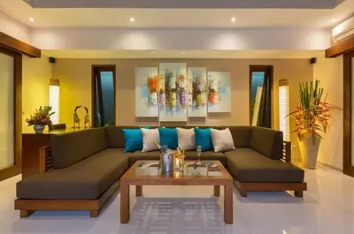 a living room with a couch and a coffee table at ViLLA GREEN MANGO SEMINYAK BALI in Seminyak