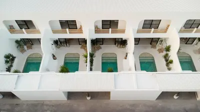 an external view of a building with balconies at Villa Casa Gaia 1 by BaliSuperHost in Umalas