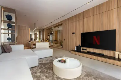 a living room with a tv on a wall at Alex Villas Complex N5 in Canggu
