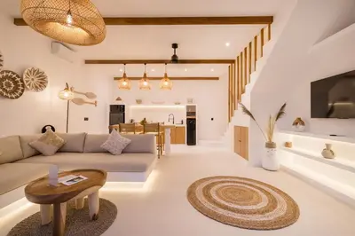 a living room with a couch and a table at Villa Casa Gaia 5 by BaliSuperHost in Kerobokan