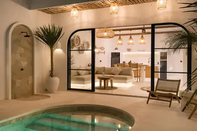 a living room with a swimming pool in a house at Villa Casa Gaia 6 by BaliSuperHost in Kerobokan