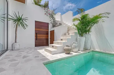 a villa with a swimming pool and a house at New Magnificent 3BR 5min to Finns & Berawa Beach Villa Alemar in Canggu
