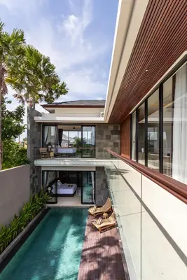 an external view of a house with a swimming pool at Trendy Modern and Spacious 3Bd Villa in Umalas in Kerobokan