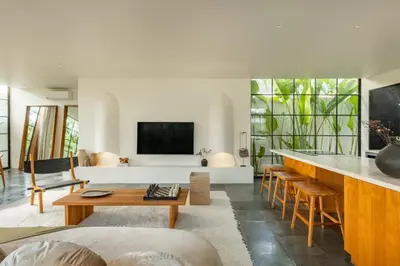 a living room with a counter and a table at Casa Siella in Canggu