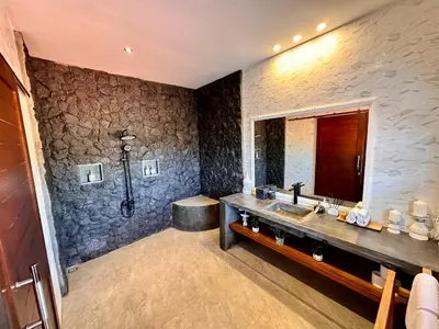a bathroom with a sink and a shower at The Getaway Villa Seminyak Bali in Seminyak