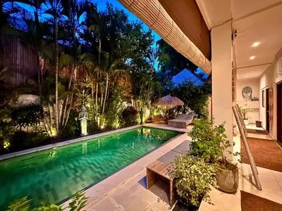 a swimming pool in the middle of a house at The Getaway Villa Seminyak Bali in Seminyak