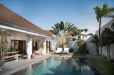 a swimming pool in the backyard of a villa at Tropical 3bdr poolvilla in heart of Seminyak in Seminyak