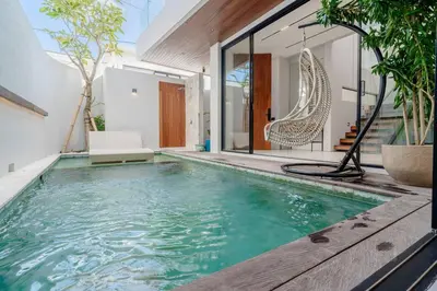 a swimming pool in the middle of a house at Casa Estella Stunning 2BR in Umalas Canggu in Kerobokan