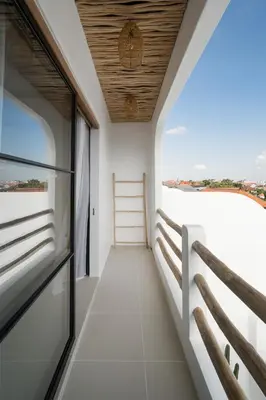 a balcony with a view of the ocean at Villa Casa Gaia 2 by BaliSuperHost in Kerobokan