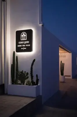 a sign on the side of a building with cactus at Villa Casa Gaia 2 by BaliSuperHost in Kerobokan