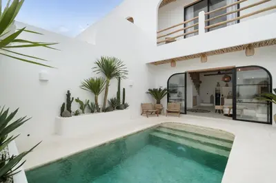 a house with a swimming pool in the yard at Villa Casa Gaia 4 by BaliSuperHost in Kerobokan