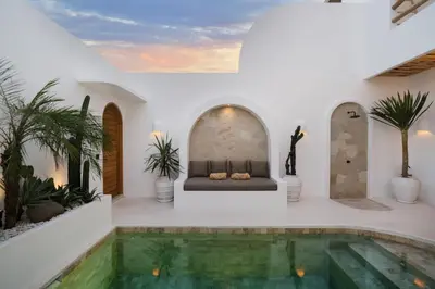 a villa with a swimming pool and a couch at Villa Casa Gaia 4 by BaliSuperHost in Kerobokan