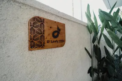 a wooden switch on the side of a wall at D'Leafy Seminyak in Seminyak