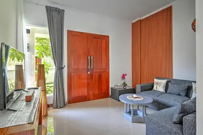 a living room with a couch and a table at PRIVATE 3BR - Yash Villa at Seminyak in Kerobokan